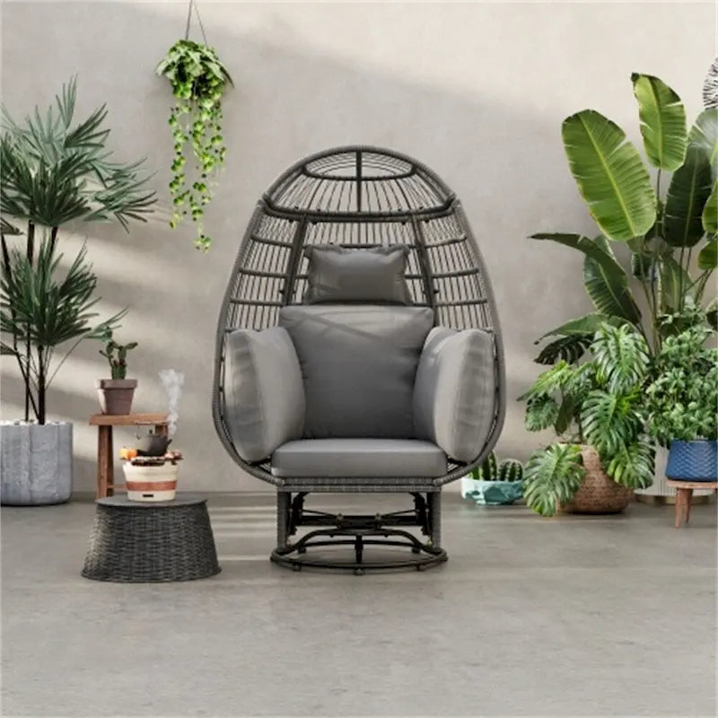 Fauteuil pivotant de jardin en rotin en forme d'œuf avec coussins et fonction bascule