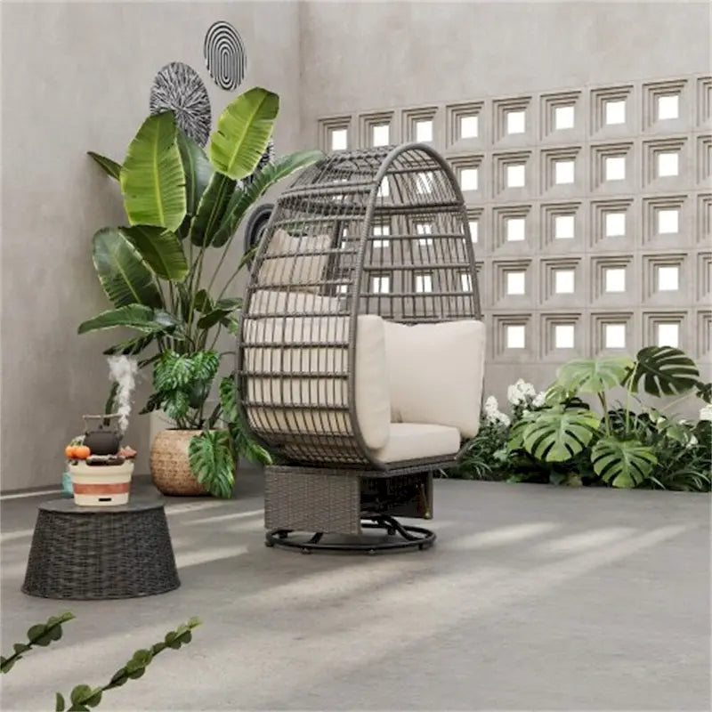 Fauteuil pivotant de jardin en rotin en forme d'œuf avec coussins et fonction bascule
