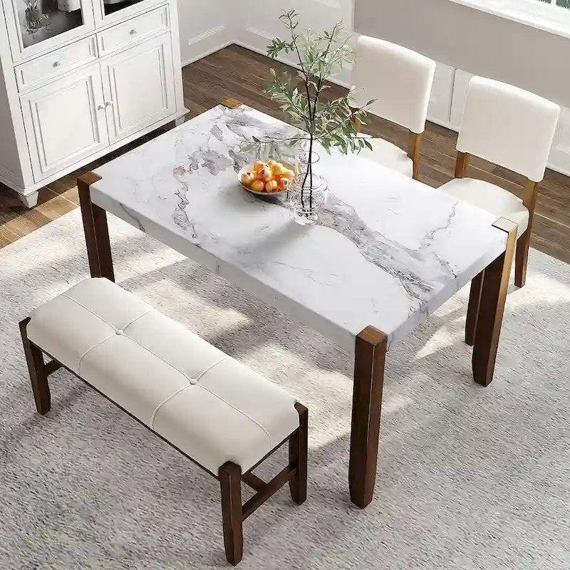 Ensemble de salle à manger 4 pièces comprenant une table style faux marbre, 2 chaises rembourrées et un banc à pieds en bois.