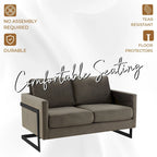 Canapé deux places capitonné en velours avec coussins amovibles et structure en acier inoxydable